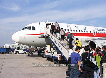 Passengers board the airplane