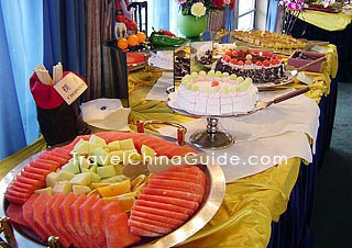 Fruit and cake in a cafeteria 