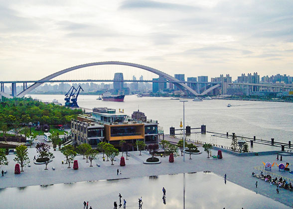 Shanghai Lupu Bridge seen from Expo Park at dusk 