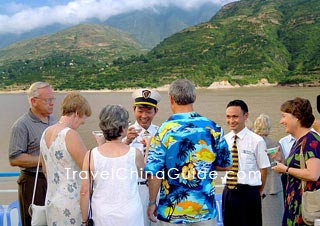 People wear formal attire on Captain's Welcome Cocktail Party