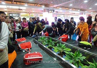 Tourists Waiting for Their Luggage